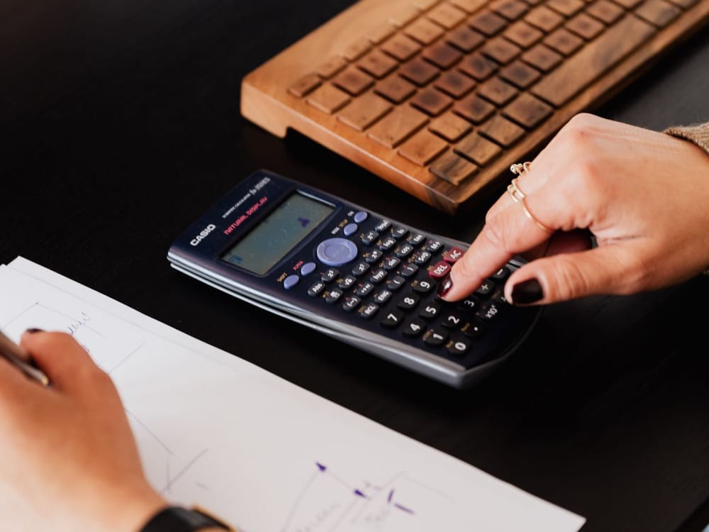 Running the numbers on a calculator during a planning session